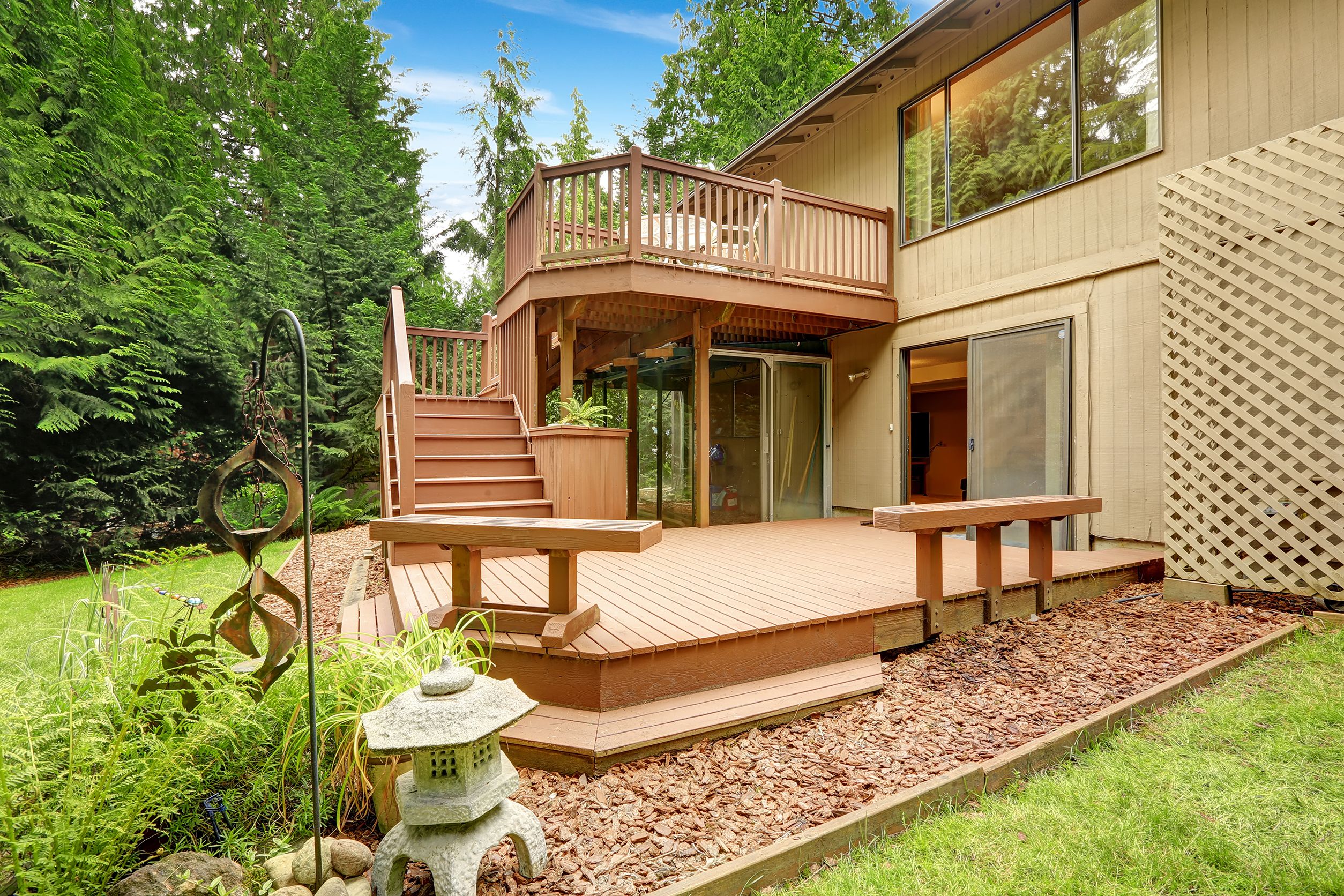 Elevated wooden deck with a staircase leading
