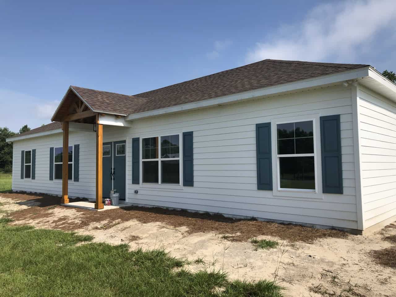 White siding with blue shutters