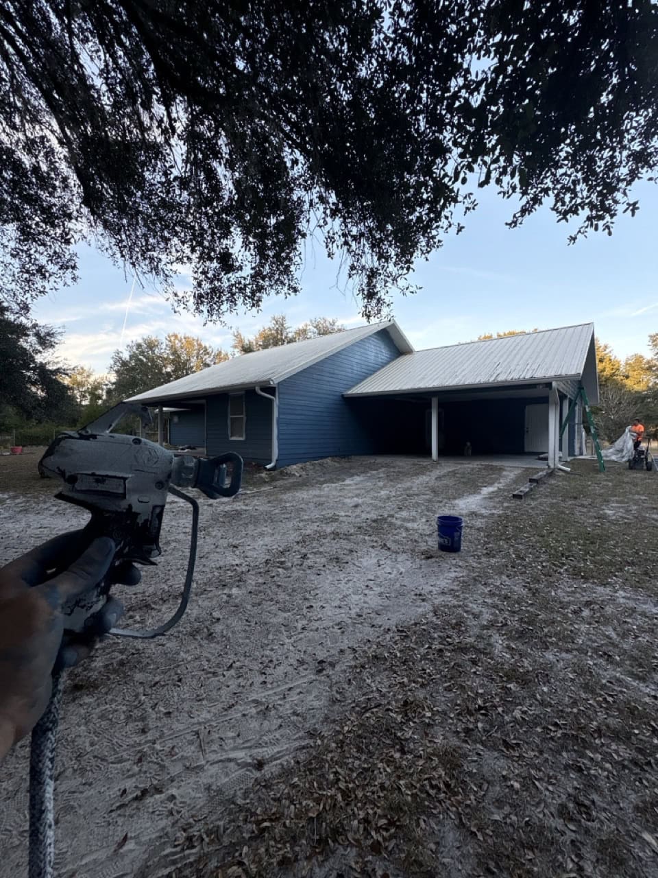 Exterior siding repair and painting in progress